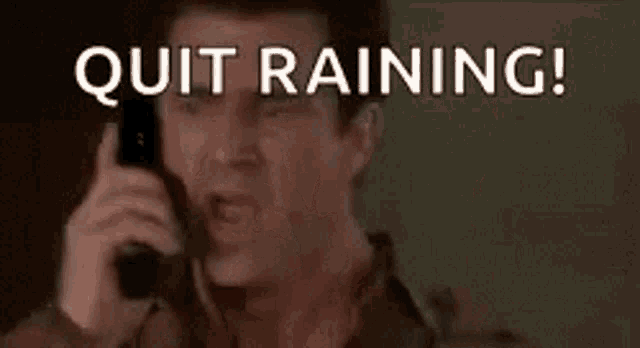 a man is talking on a cell phone and saying `` quit raining , give me back my sun '' .