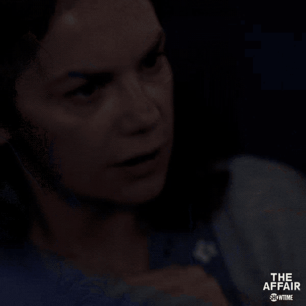 a man in a blue shirt is sitting in a dark room with the words the affair showtime behind him