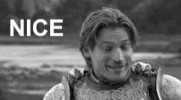 a man in armor is smiling in a black and white photo with the word nice in the background .
