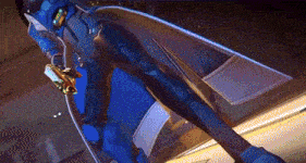 a person in a blue suit is flying through the air while holding a sword .