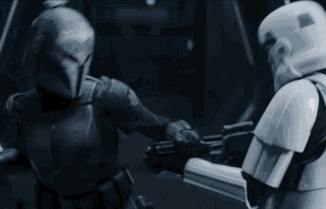a storm trooper and a mandalorian are fighting each other