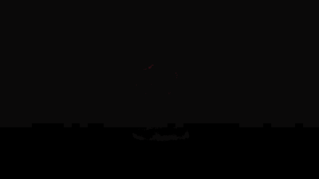 the letter r is lit up in red on a dark background