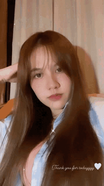 a girl with long brown hair says thank you for today yy