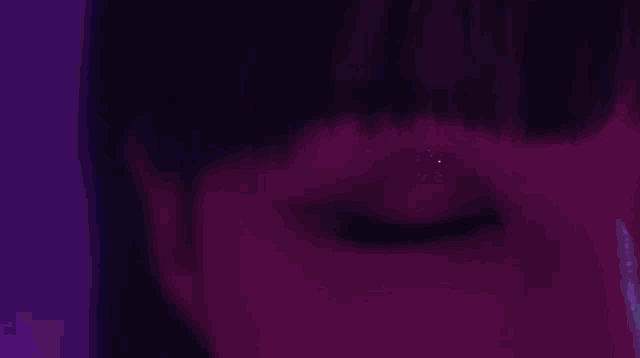 a purple tunnel with a black hole in the center