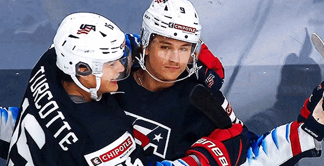 two ice hockey players one of whom has the number 21 on his jersey