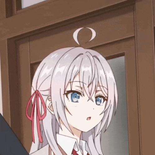 a girl with white hair and blue eyes is standing in front of a wooden door