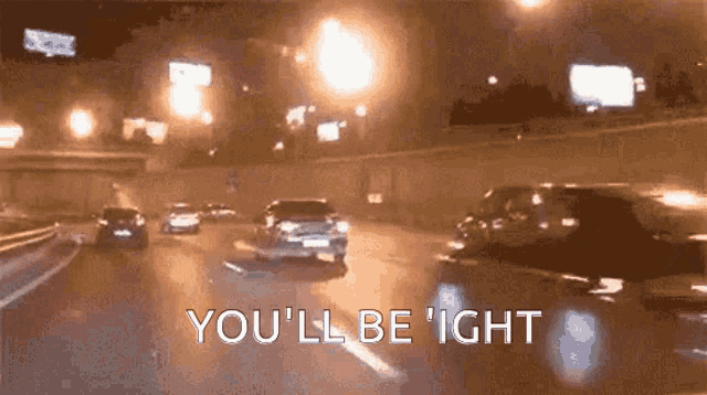 a car driving down a highway at night with the words you 'll be ' ight