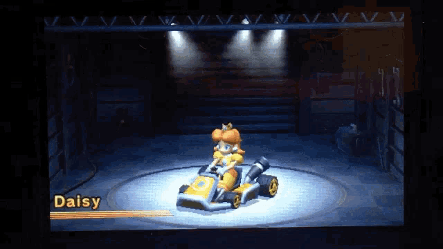 a video game screen shows a character named daisy in a kart