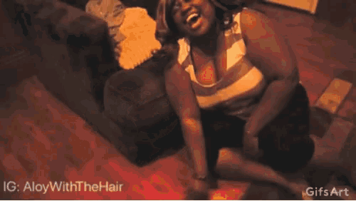 a man in a striped shirt is laying on the floor and laughing with the hashtag aloywiththehair