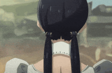 a close up of a woman 's back with a white dress