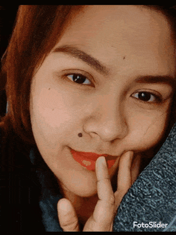 a close up of a woman 's face with the words fotoslider on the bottom left