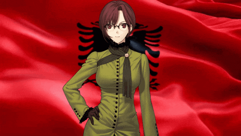 a girl in a green dress is standing in front of a red flag
