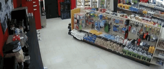 a store with a lot of shelves including one that has a sign that says ' a ' on it