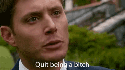 a man in a suit and tie is making a funny face and saying `` quit being a bitch '' .