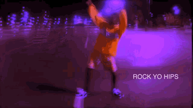 a blurry picture of a person dancing with the words rock yo hips in the corner