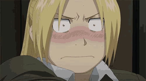 a close up of a person making a funny face with their eyes closed .