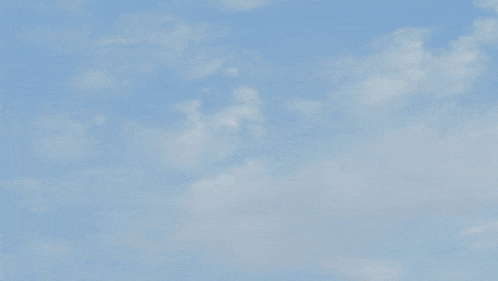 a yellow object with a blue sky in the background and the word ' o ' on it