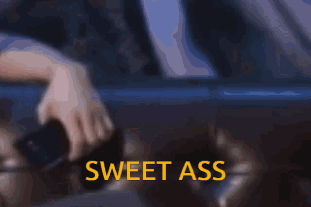 a blurred image with the words sweet ass in yellow letters
