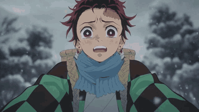 a cartoon character with a scarf around his neck has a tear running down his cheek