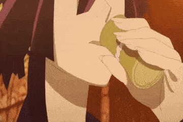 a close up of a person drinking from a cup