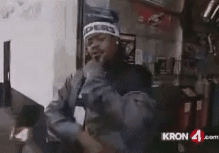 a man wearing a hat with the word raiders on it is dancing