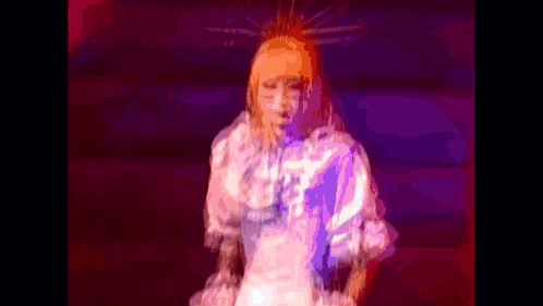 a pixelated image of a woman in a white dress with a crown on her head