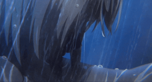 a close up of a person 's face with water drops on it