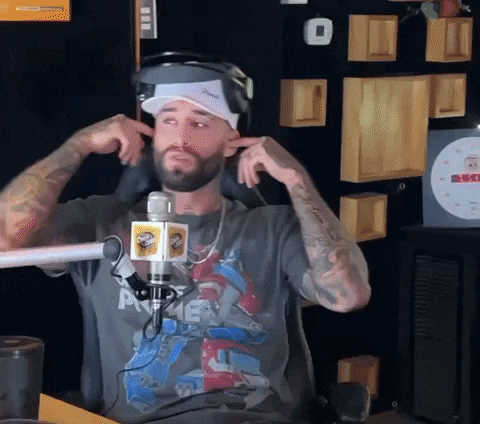 a man with a beard wearing headphones and a shirt that says prime