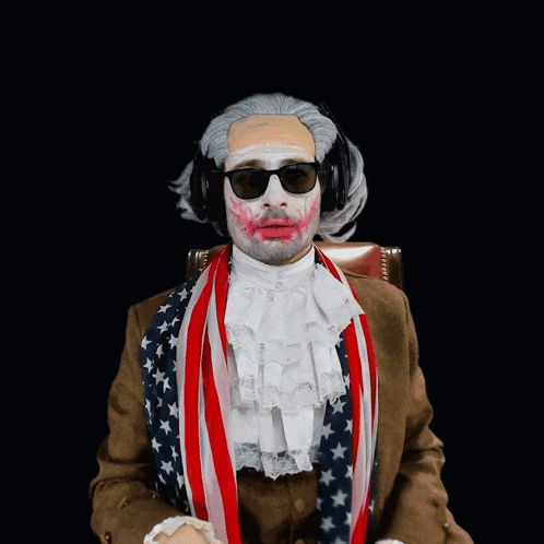 a man with a beard and face paint wearing sunglasses
