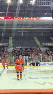 a hockey player wearing a jersey with the number 23 on it