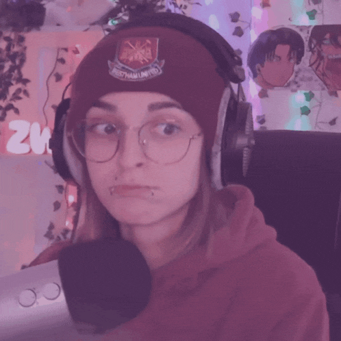 a woman wearing a beanie with west ham united on it