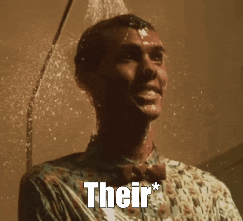 a man in a bow tie is taking a shower with the words " their " on the bottom
