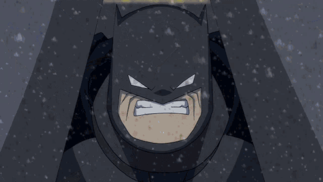 a close up of a man 's face with snow falling