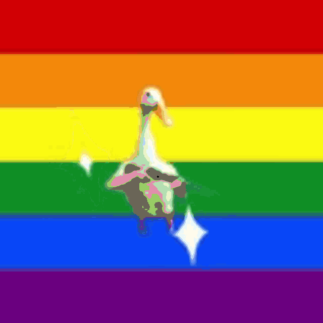 a duck is standing in front of a rainbow flag with a sparkle .