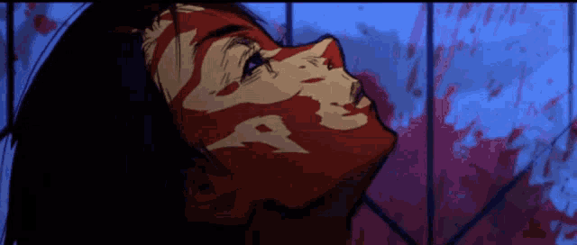 a woman with blood on her face looks up