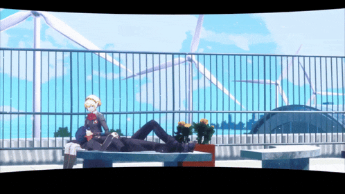 a man and a woman sit on a bench in front of windmills