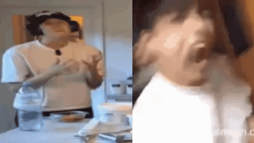 a woman in a white shirt is standing in a kitchen with her hands outstretched .