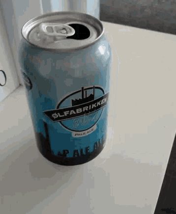 a can of olfabrikken pale ale is on a table