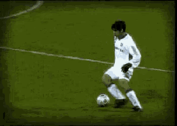 a soccer player wearing a white jersey with the number 23 on it