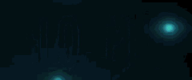 a blue light is shining in the dark and moving in a circle .