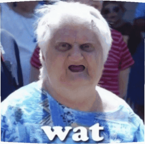 a woman in a blue shirt with the word wat on her shirt