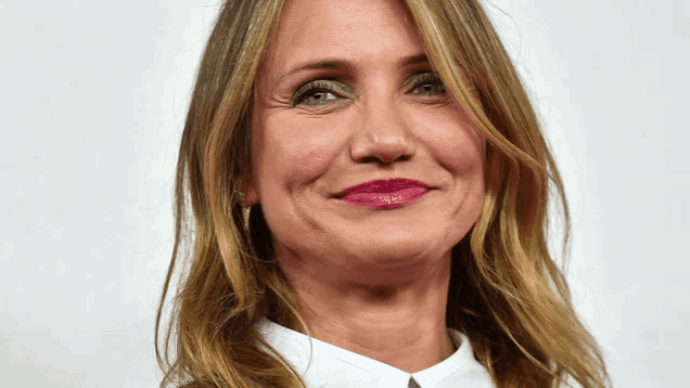 a close up of a woman 's face with a white shirt
