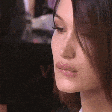 a close up of a woman 's face with long hair