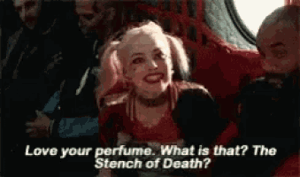 harley quinn from the movie suicide squad is talking to a man in a plane .