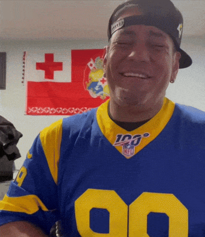 a man wearing a blue and yellow nfl jersey