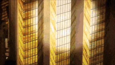 a tall building with a lot of windows is lit up