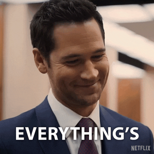 a man in a suit and tie is smiling and says everything 's