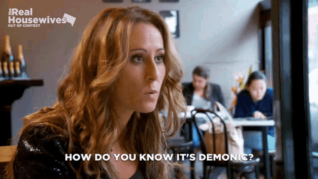 a woman says how do you know it 's demonic in front of a real housewives logo