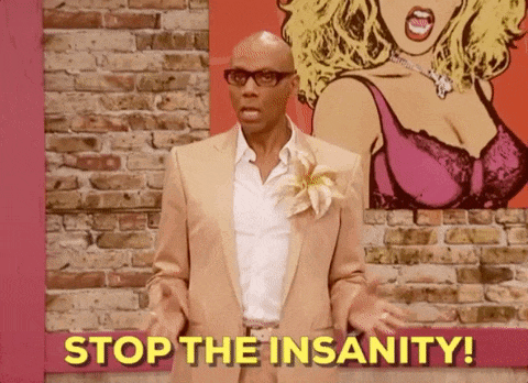 a man in a tan suit says stop the insanity in front of a brick wall