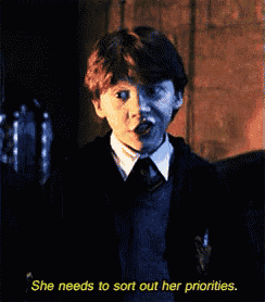 a boy in a suit and tie is talking about sorting out her priorities